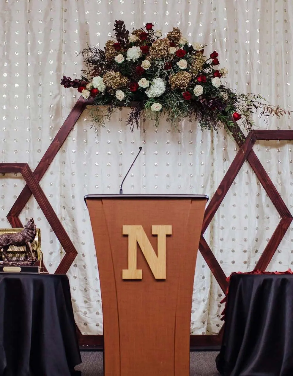 Podium with flowers behind it